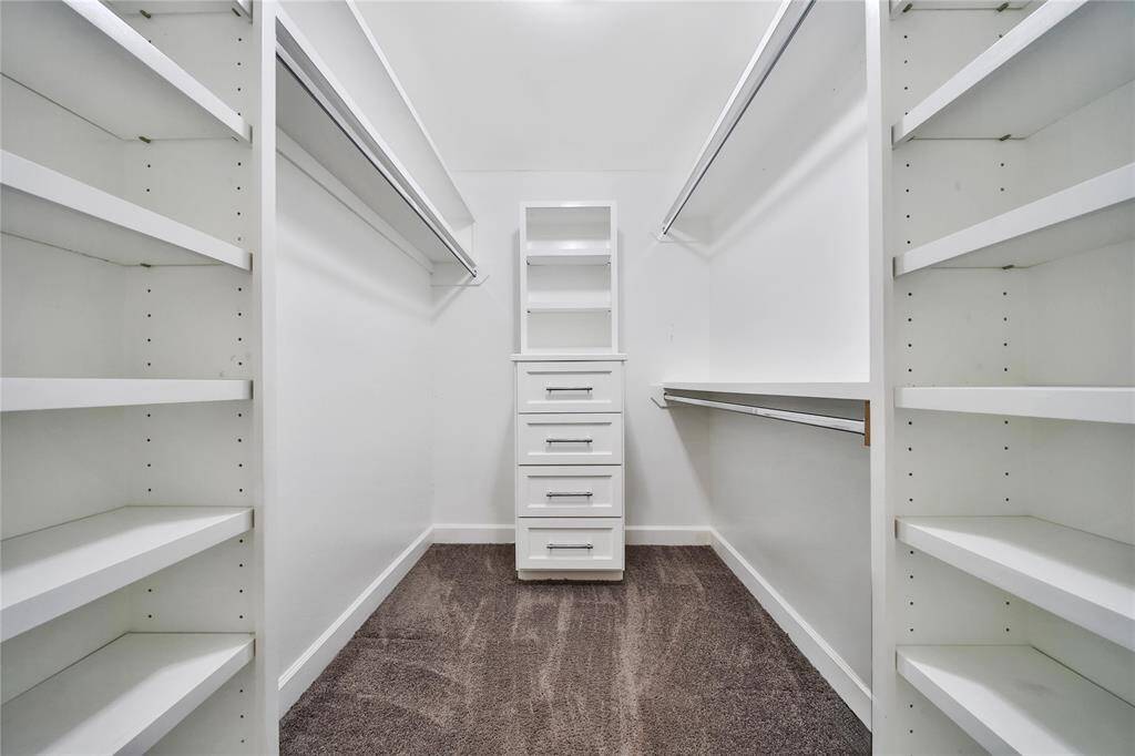 Expansive primary closet.
