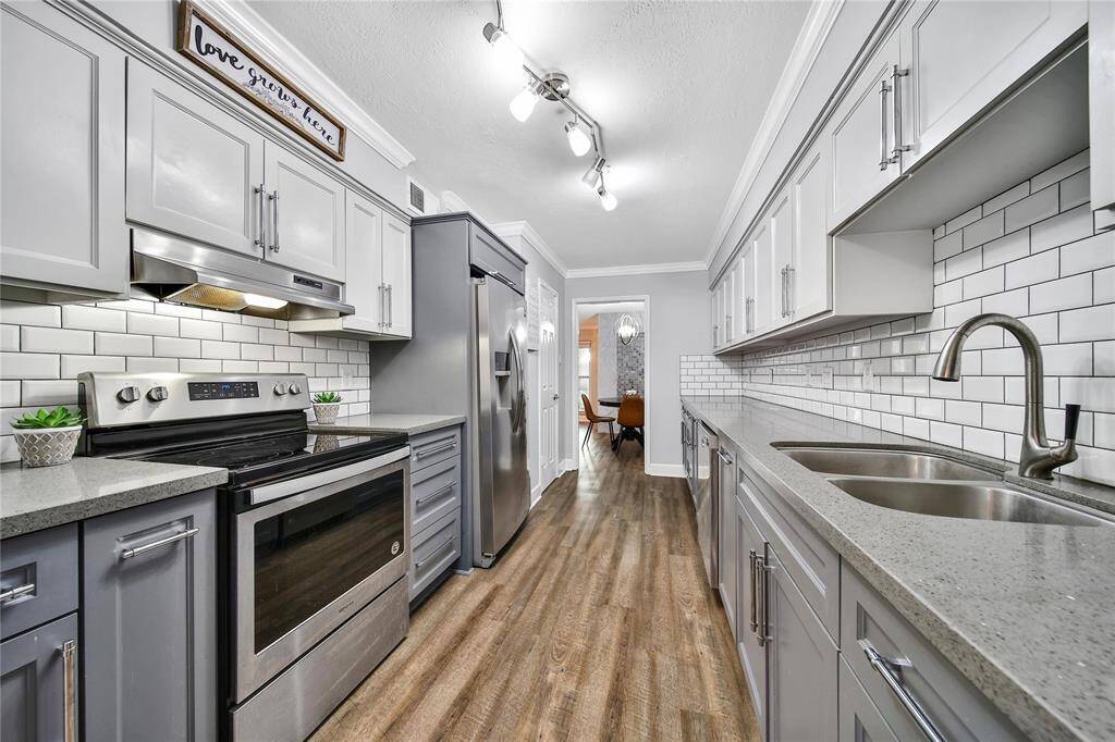 Beautiful kitchen featuring updated appliances and custom cabinetry.