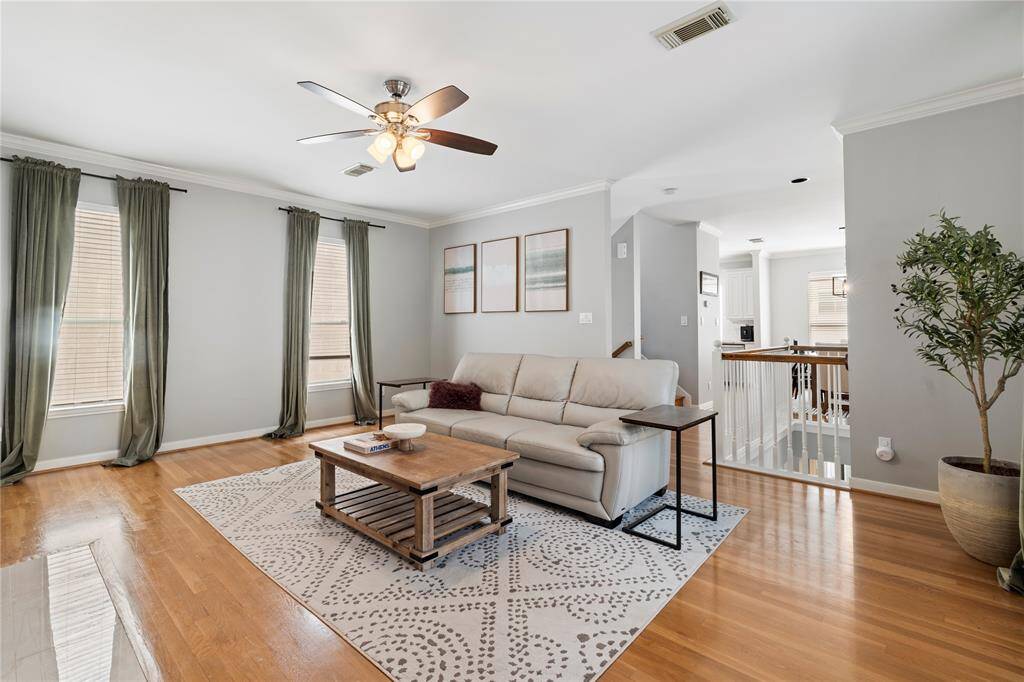 The soft, neutral paint colors and crown molding create an elegant, versatile backdrop that complements any style. The thoughtful floor plan flows seamlessly