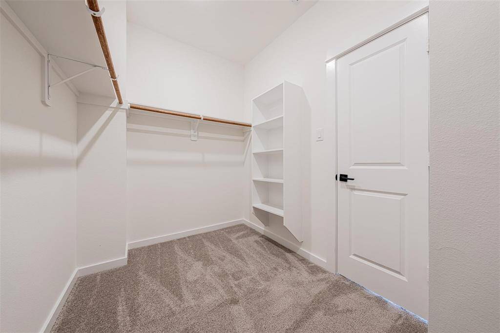 Primary walk in closet.