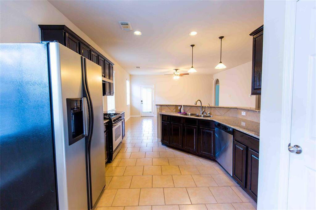 Granite countertop in the kitchen. Plenty of cabinet space. Refrigerator not included. Available upon request