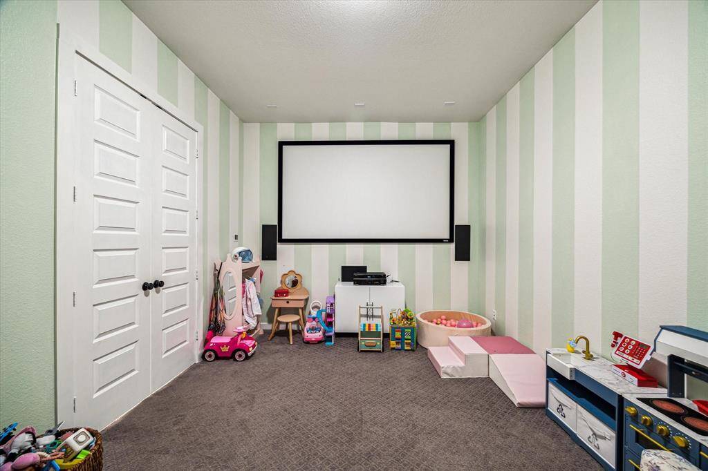 Further down the hallway is theMedia Room. Currently beingused as a gameroom...it isequiped with a high definitionprojector and large screen.