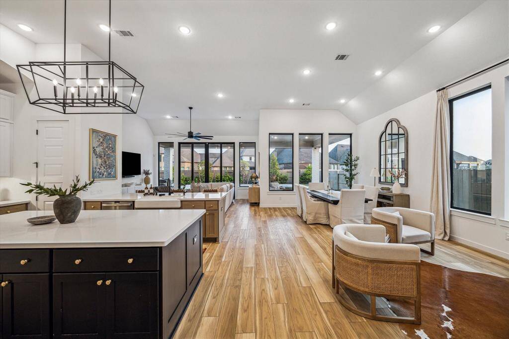 Step into your breathtaking livingroom, kitchen, dining area, andopen to the family room.
