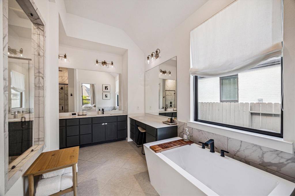 Luxury continues as you enter the primary bathroom suite! Your own person spa! Separate soaking tub, walk in shower that features TWO shower heads and tons of countertop space to get ready for your day!