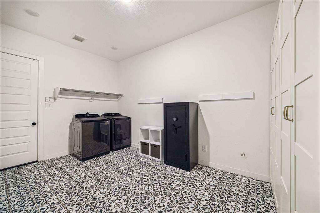 Oversized utility room is a great feature to this home...offering extra storage, and tons of room for all your Costco or Sams purchases!