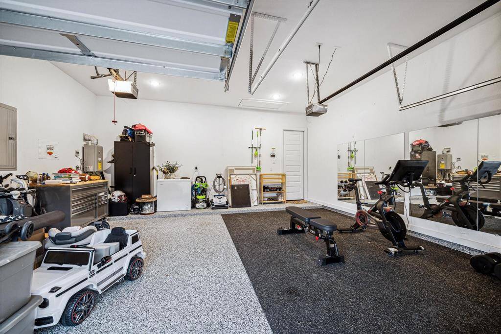 Garage offers a place to park your car...or be your own home gym! Epoxy flooring and large mirror provides the owners a clean and multiuse area!