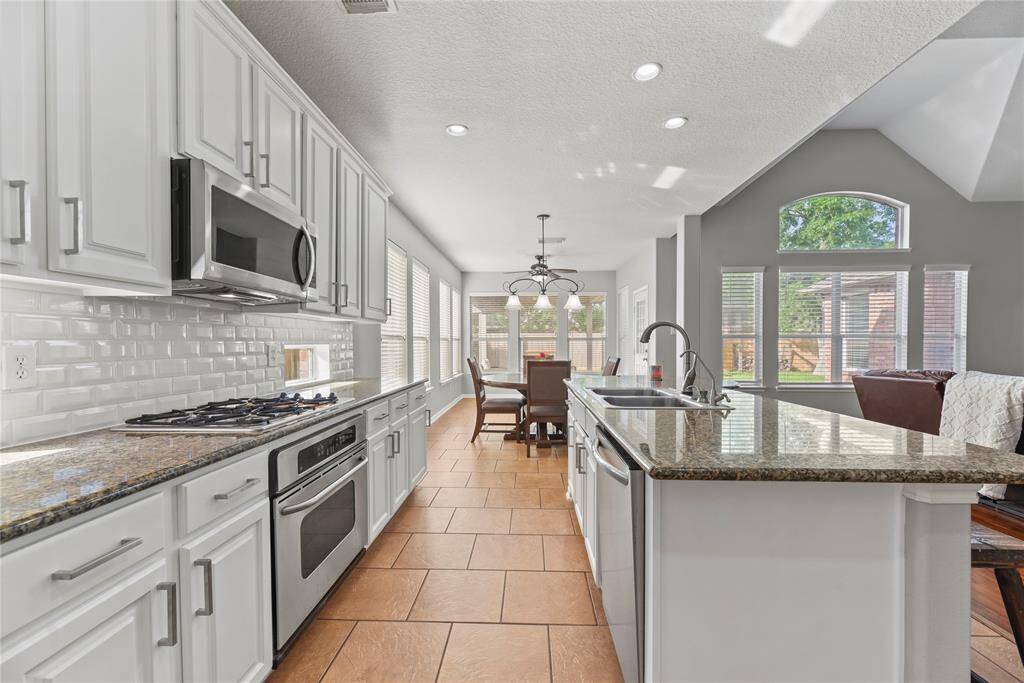 Entertaining is a breeze with an open-concept kitchen and living area. Whip up appetizers for your guests in your air-fryer or enlist their help to bake several dozen cookies for the upcoming charity bake-sale!