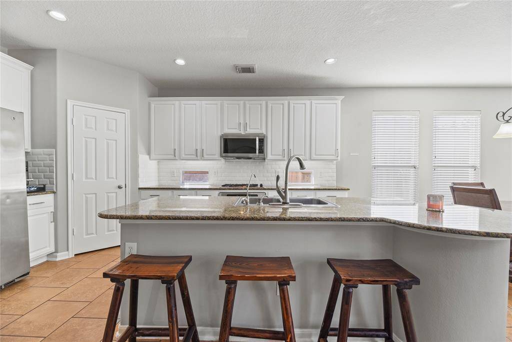 Truly open concept, the family room has clear sights to both the dining area and kitchen. Whether entertaining guests or keeping an eye on the littles, this layout delivers for modern needs and desires.