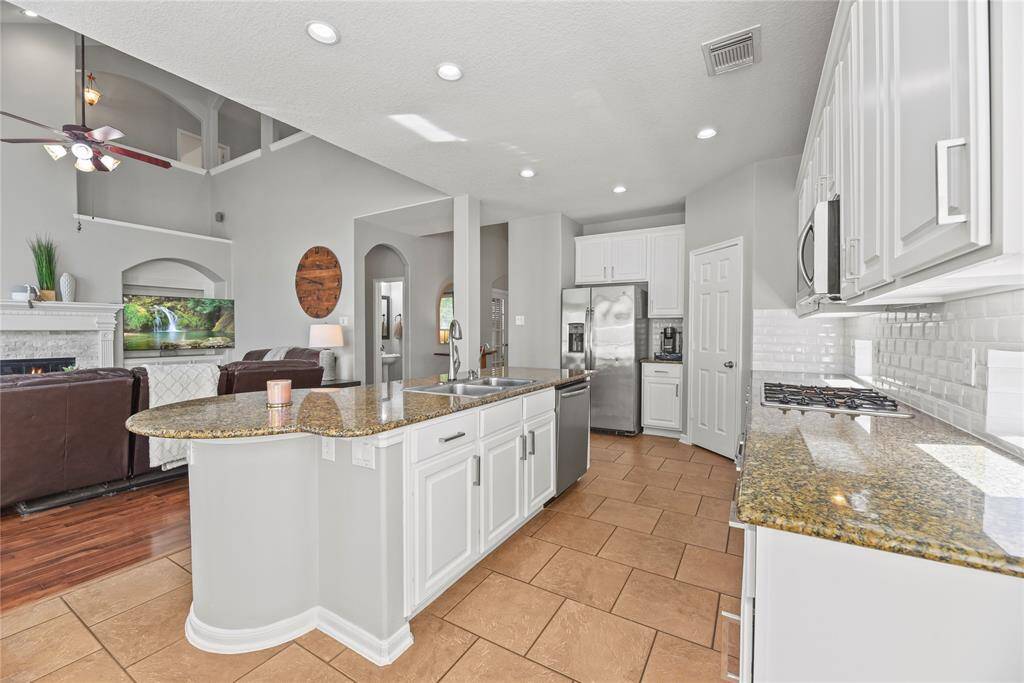 Several windows in the family room display an amazing view of the spectacular backyard!