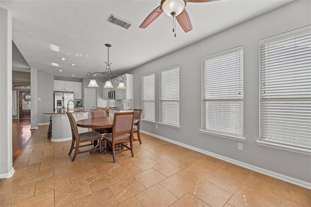 High ceilings, wood floors, and ample windows provide the primary bedroom with a sense of gratifying bliss. Overly sized, this leisurely space accommodates large furniture and a wide range of styles.