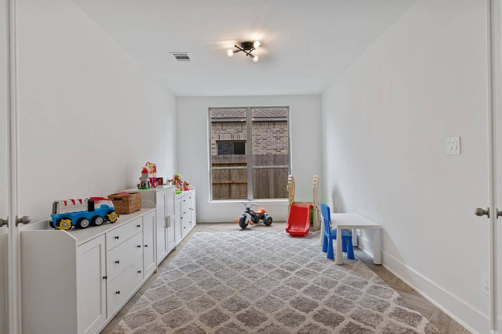 Bright, spacious flex space with double glass doors.