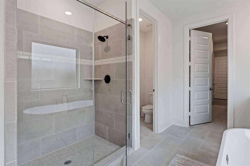 Spacious, luxurious shower.