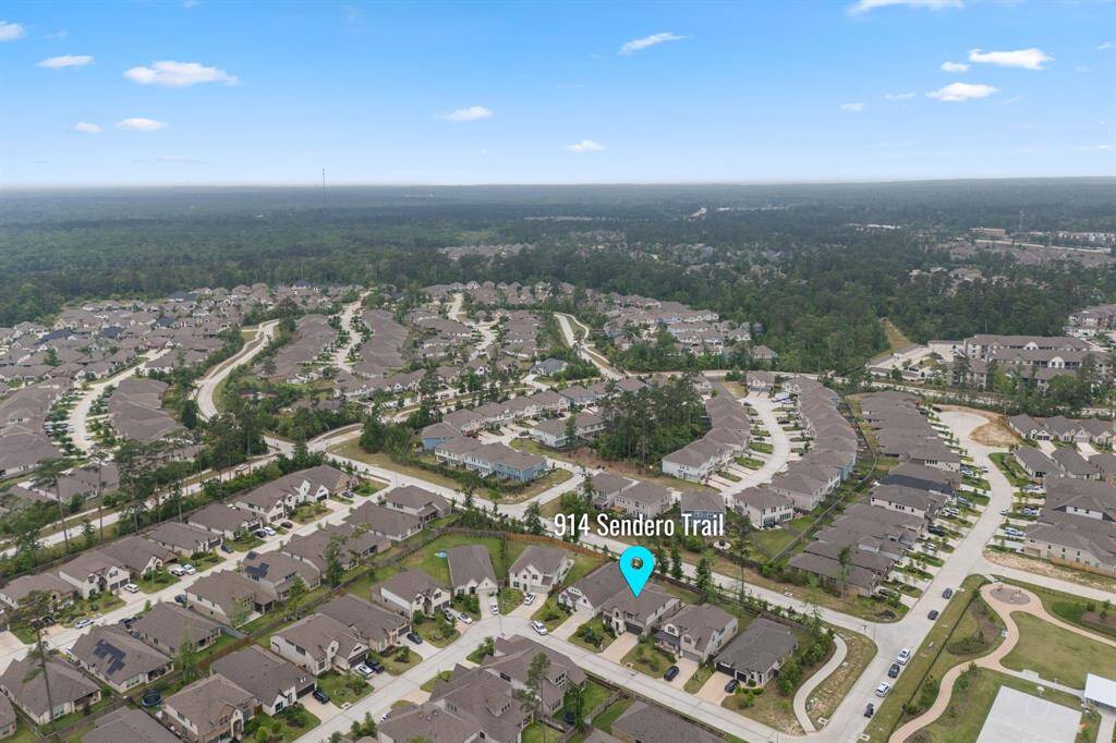 Discover a serene suburban neighborhood, nestled in lush greenery. Enjoy uniform, stylish homes and pristine streets, perfect for peaceful living.