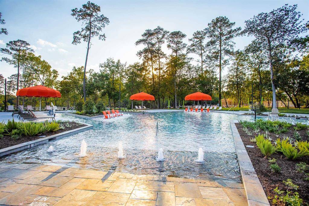 Discover tranquility at this inviting community pool, nestled amidst lush greenery—ideal for relaxation and outdoor fun.