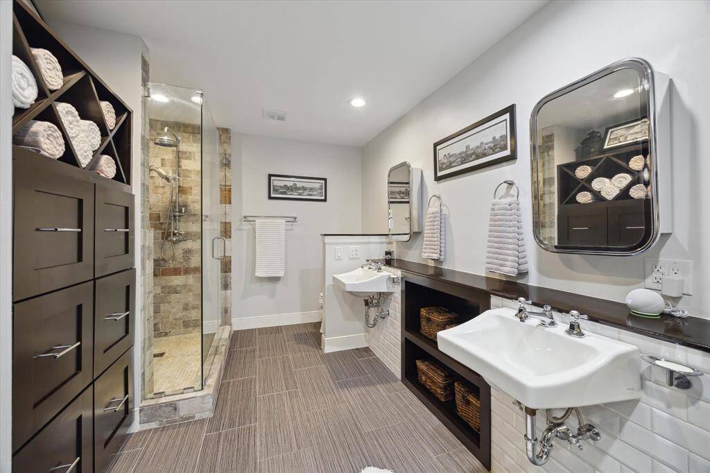 Primary bath has been updated and features dual sinks and a walk in shower.