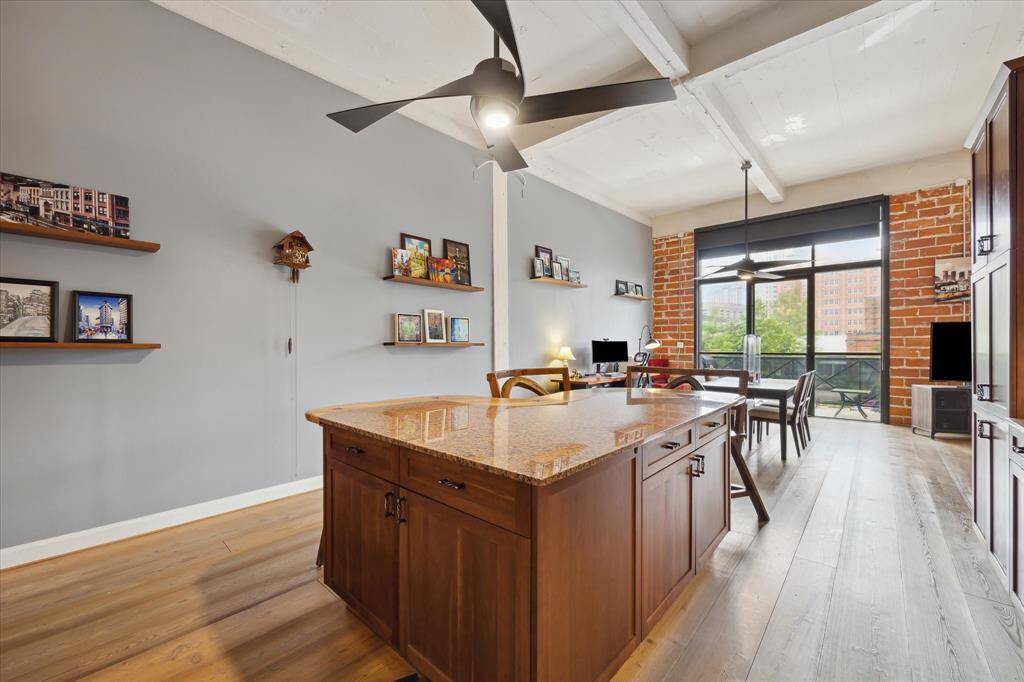 Granite topped kitchen island offers additional storage.