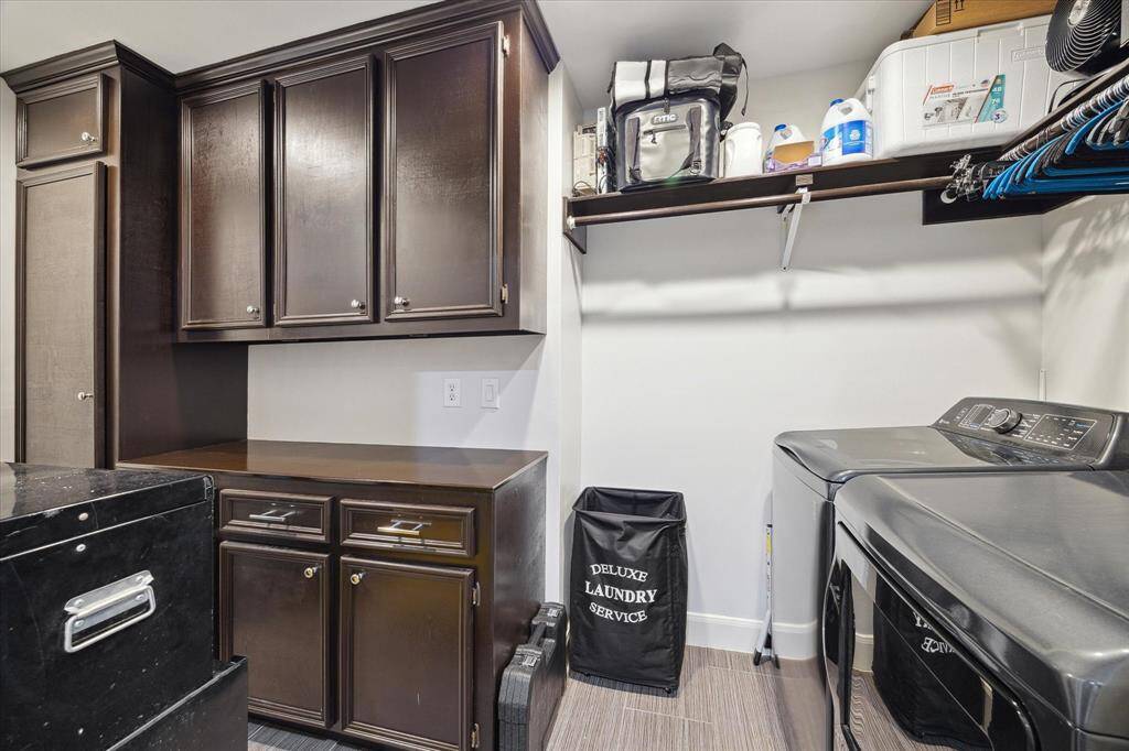 The full size laundry room has plenty of storage.