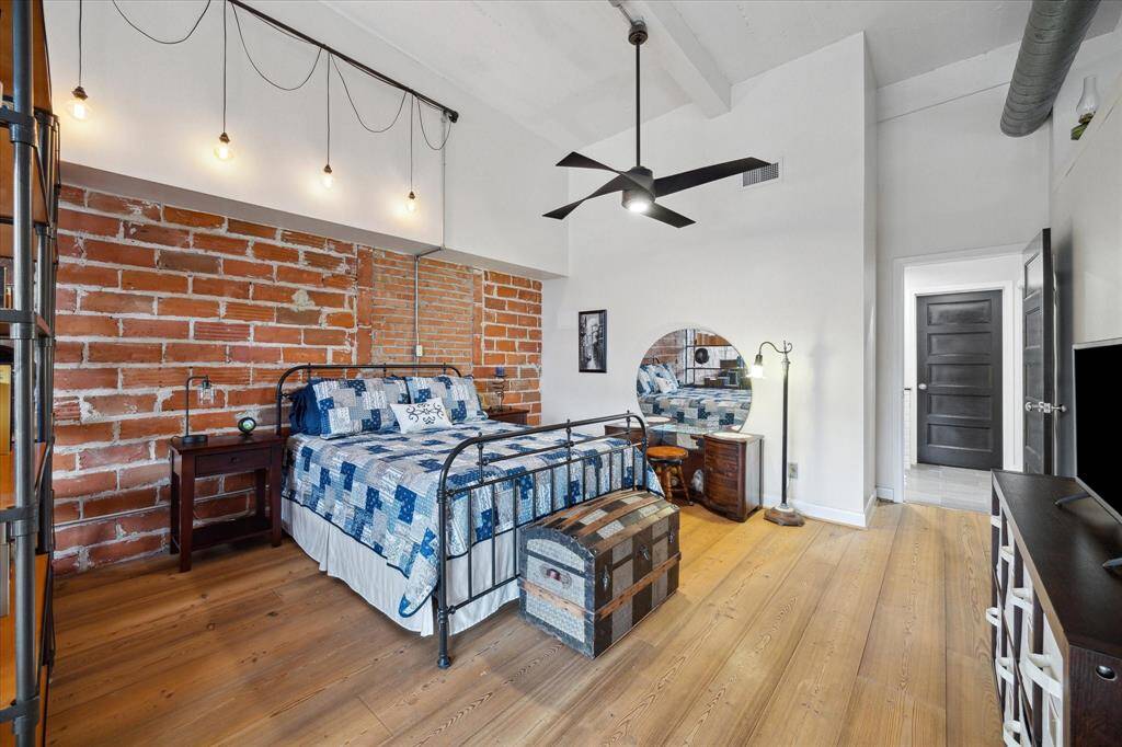 The bedroom space is tucked in the back of the unit with laundry, closet and primary bath attached.