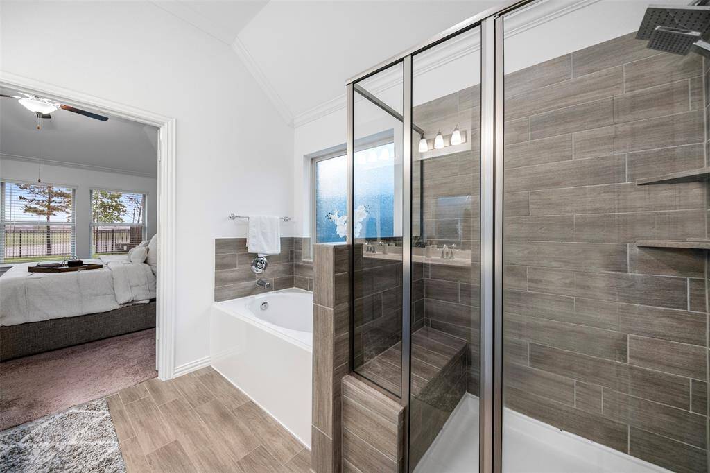 The primary bath offers a walk-in-shower plus a soaking tub!