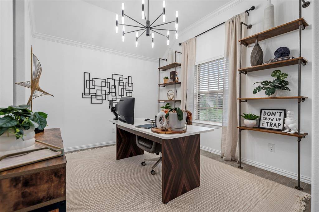 Upon entry to the home, you are greeted with the formal dining room (currently being used as a home office).