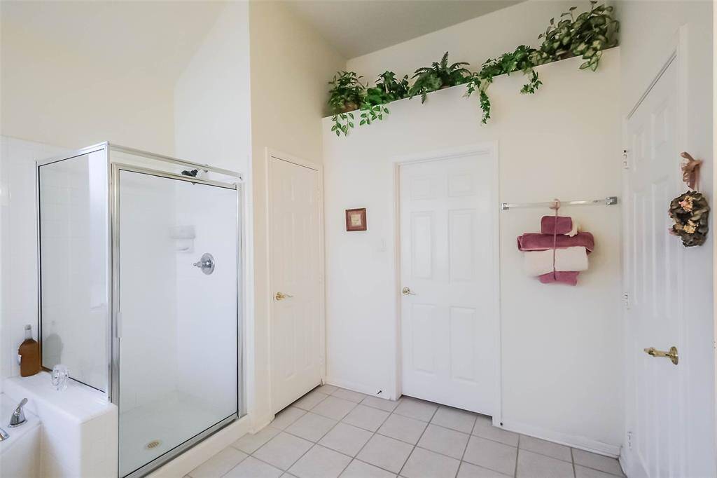 One of the "must sees" is the space of the walk-in closet in the owner's retreat. Separate water closet entry is seen on the left.