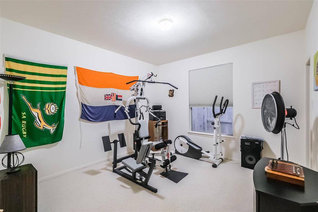 Currently being used as a home gym, this can also be a secondary bedroom.