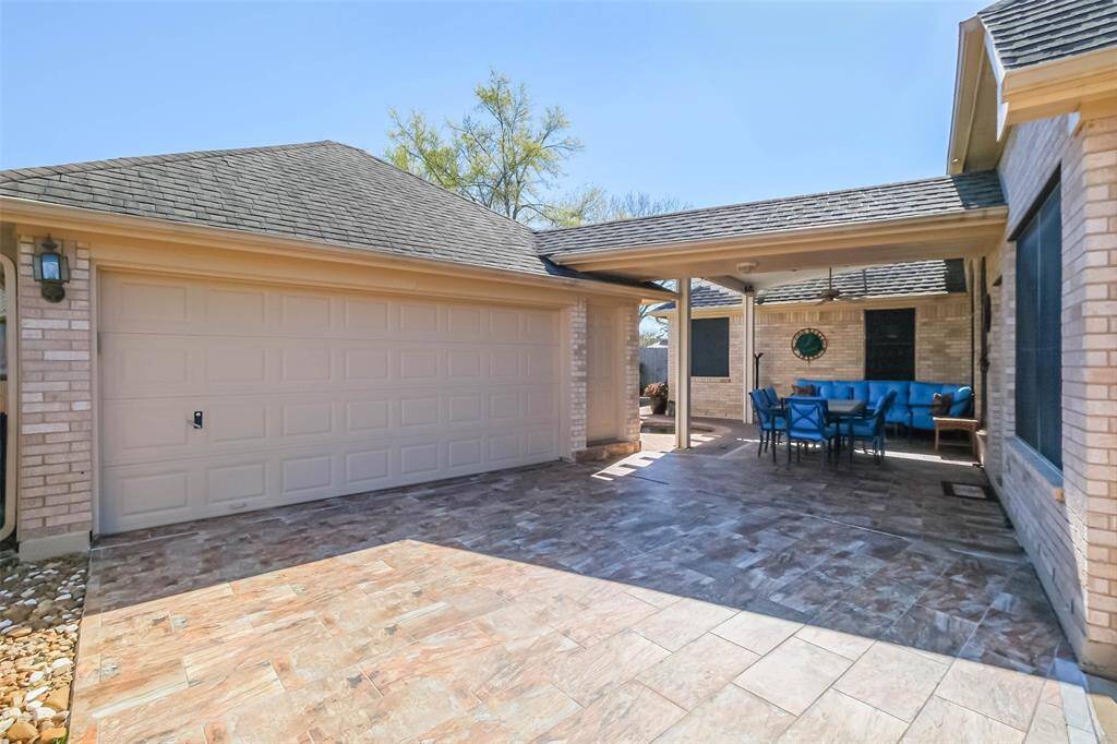 Tiled garage entry and back patio allow for stylish, easy cleaning