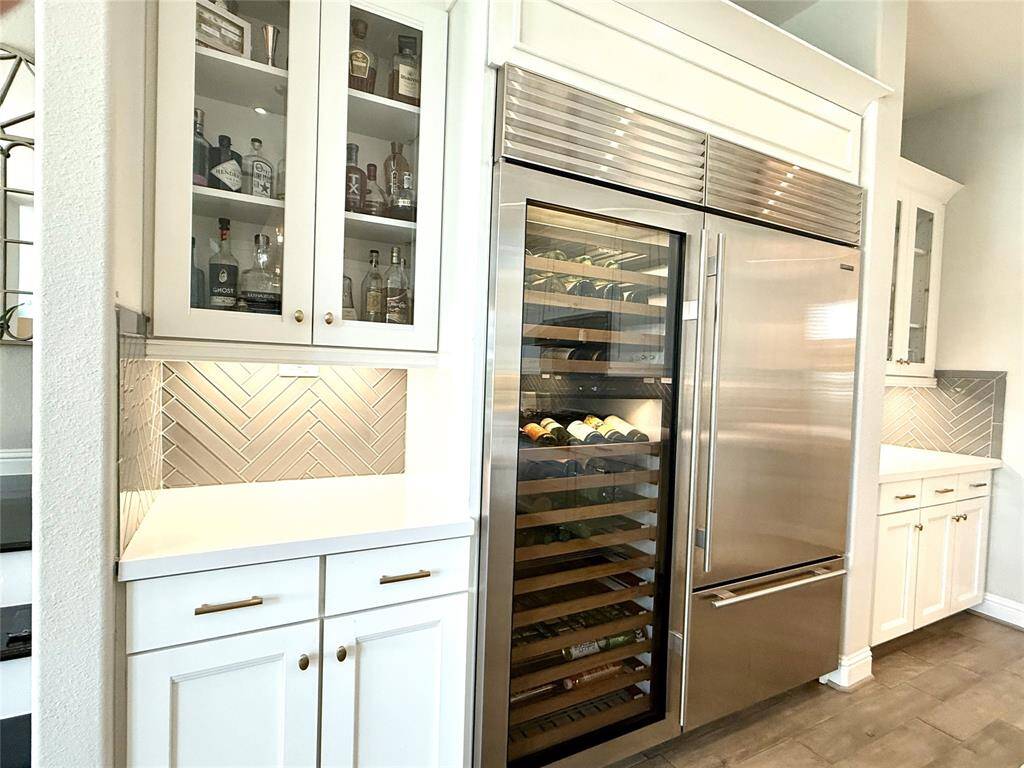 Close up shot of the phenomenal Sub-Zero Refrigerator with 148 bottle wine cooler and freezer drawer.