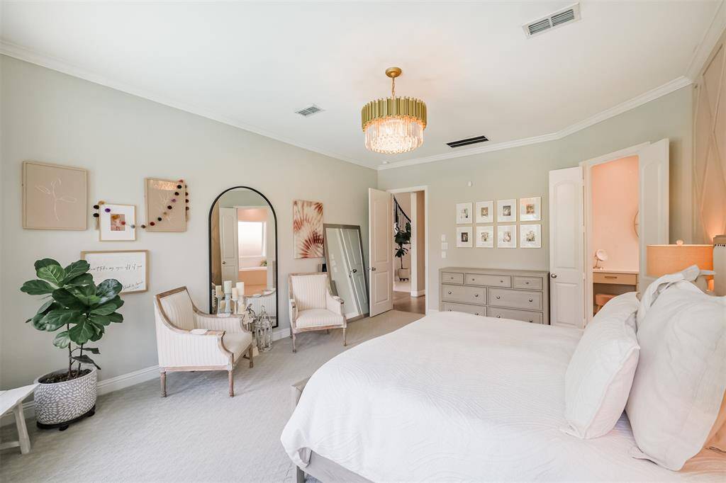 Such a relaxing space with soothing, neutral paint and carpet colors. The owner upgraded the carpet padding to 1" throughout the house. Through double doors is the en-suite bathroom.