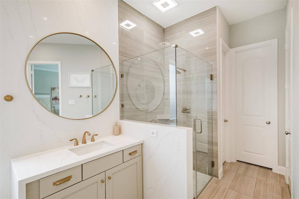 The spacious, glass enclosed shower provides an invigorating start to our day. Dual, primary walk-in closets!