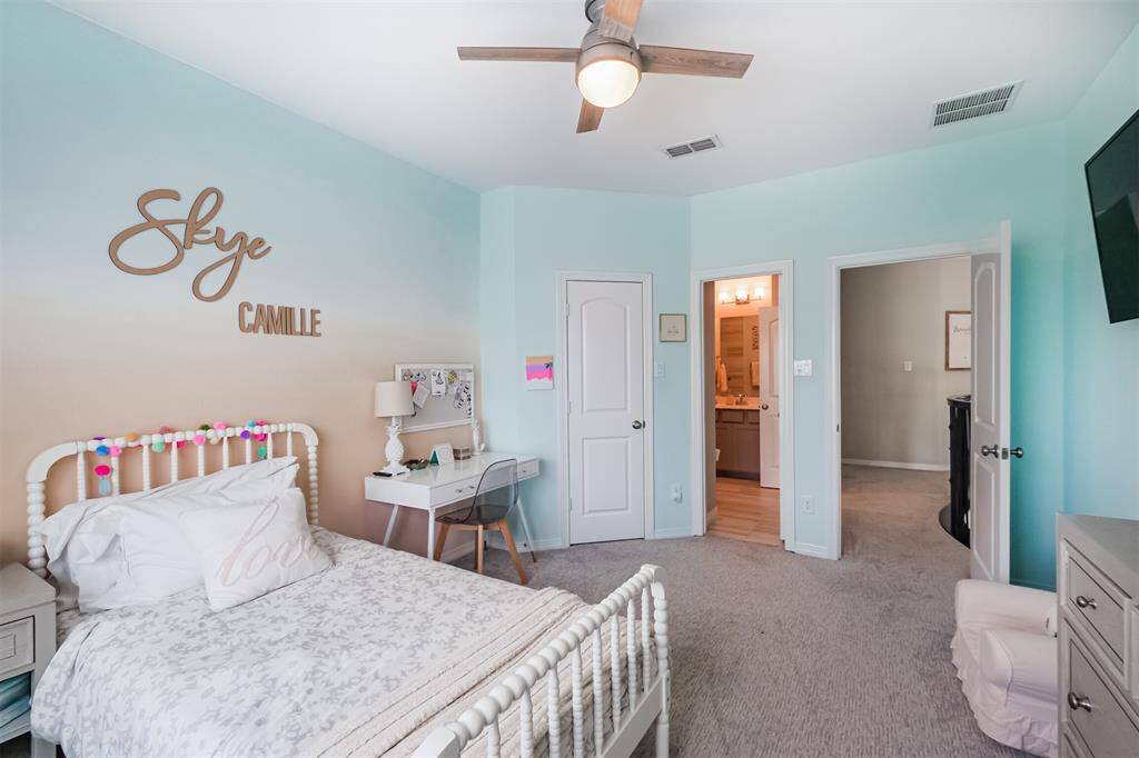 This bedroom has a walk in closet and en suite full bathroom.