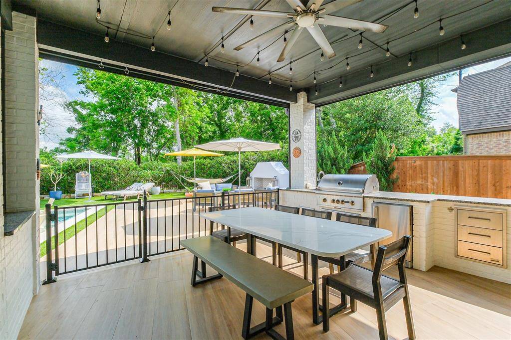 The extended covered patio provides the perfect spot for dining al fresco year round. Grill on the Coyote barbeque and keep a cold beer on hand in the adjacent Coyote fridge. Two large motorized screens can be lowered to fully enclose the space from any flying bugs. Bluetooth speakers provide music for your enjoyment.