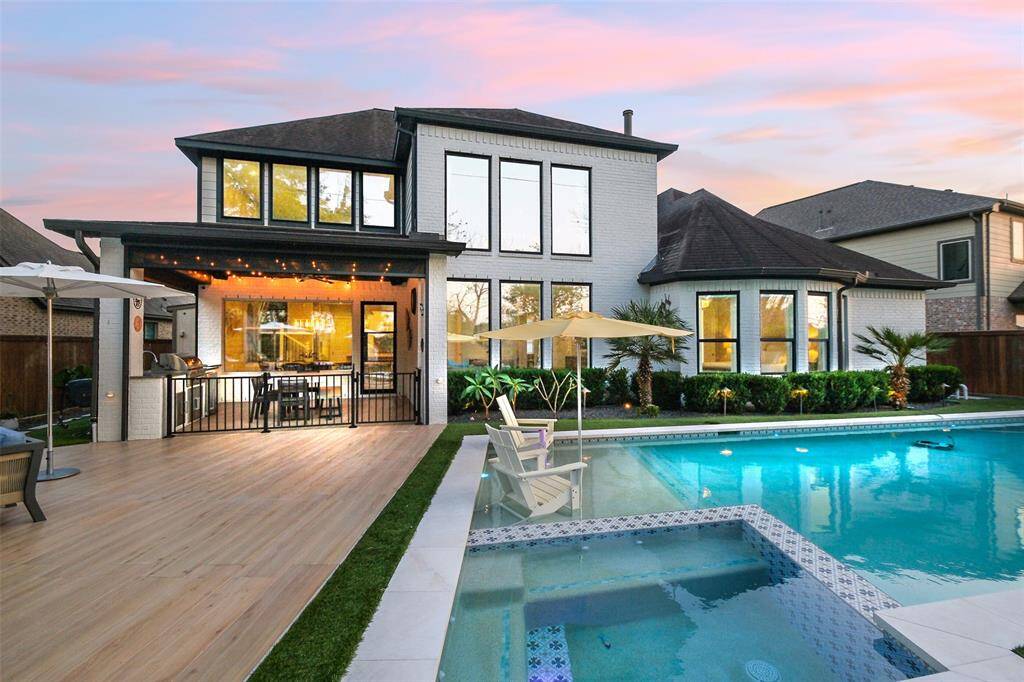 ...or just sit and admire the view of your own personal resort. Artificial turf keeps this backyard oasis low maintenance.