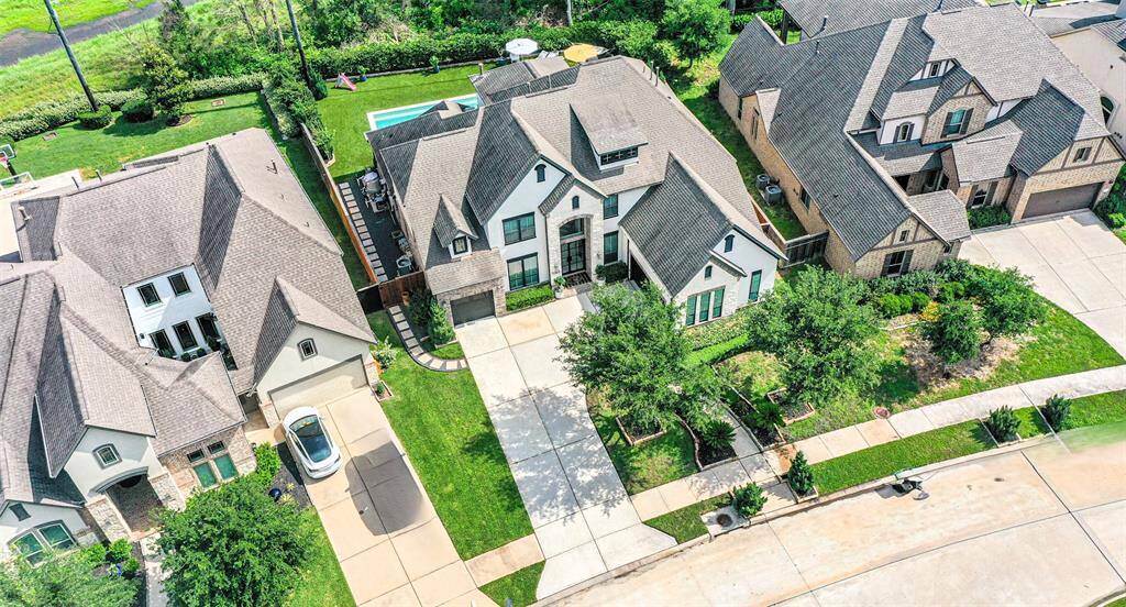 Arial view of this lovely, well maintained home and greenbelt lot