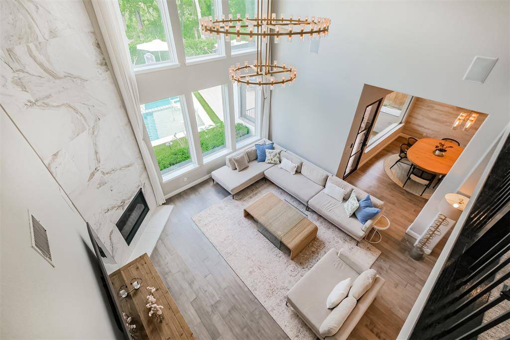 A birds eye view of the family room showcasing the two tiered, 60" Restoration Hardware chandelier.