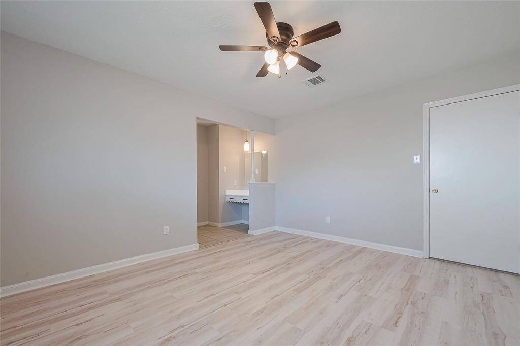 One of two bedrooms on first floor featuring ample natural light and modern finishes.