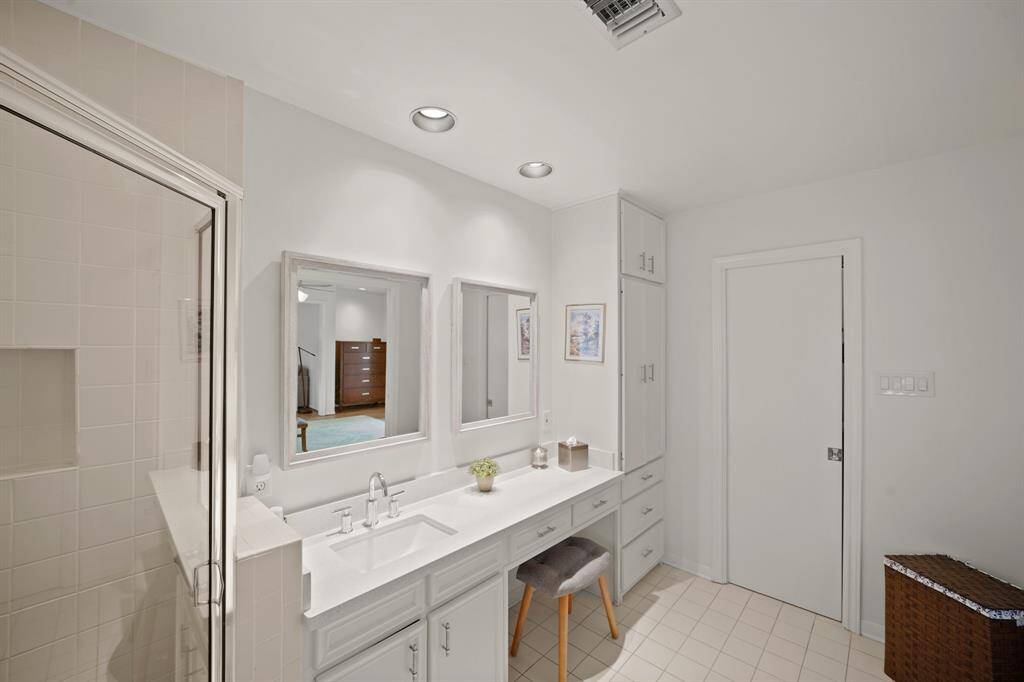 Additional Amenities in the Primary Bath include Ivory Painted Cabinets/Drawers, Dual Framed Mi