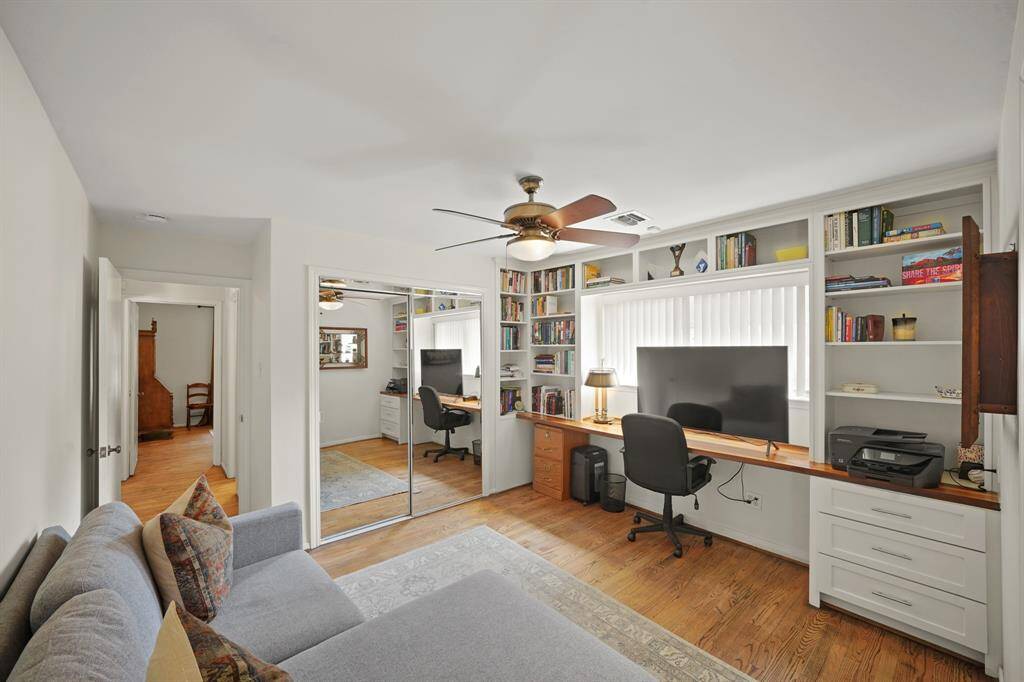 Additional Features in the Versatile Second Bedroom/Flex Room include Custom Style Built in Shelves, Built-on-Site Soft Close Drawers (2019*), Wood Stained Work Station Counter, Vertical Blinds, and a Wardrobe Closet with Mirror Faced Sliding Door Enclosure (*per Seller).
