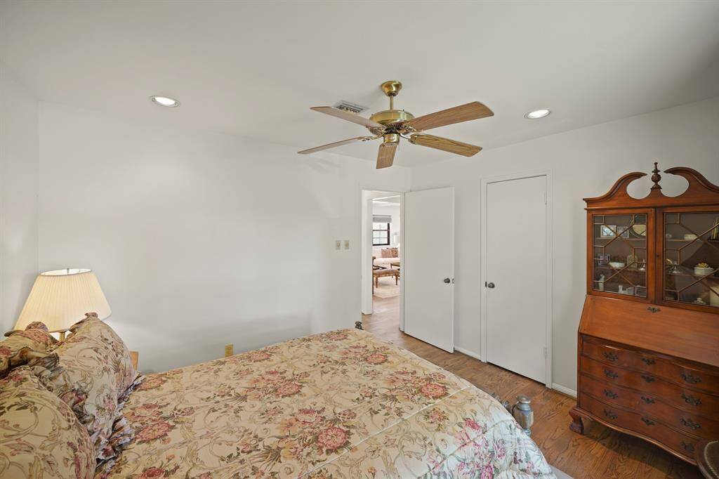 Additional Features in the Third Bedroom include Recessed Lighting, Ceiling Fan with Wood Style Blades, and a Closet with Built in Shelves and Hanging Rod.