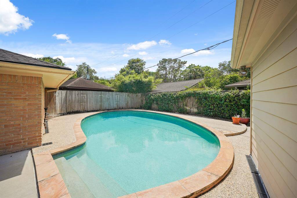 The Pebble Decking surrounding the Pool offers Space for Lounging Chairs and your Favorite Potted Plants!