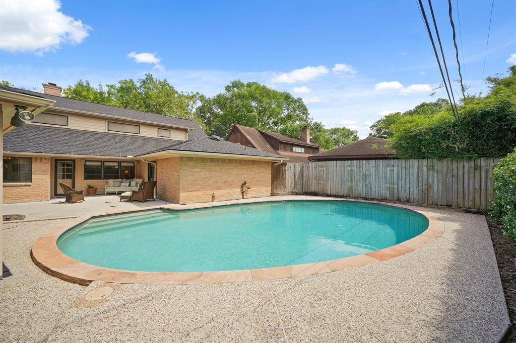 Watch Pool Activities from the Recently Poured (per Seller) Backyard Concrete Patio.  Time to invite Friends over for a Fun Splash Time Afternoon!
