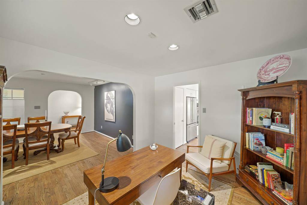The Office is located adjacent to the Dining Area and features a Pocket Door opening to the Kitchen.