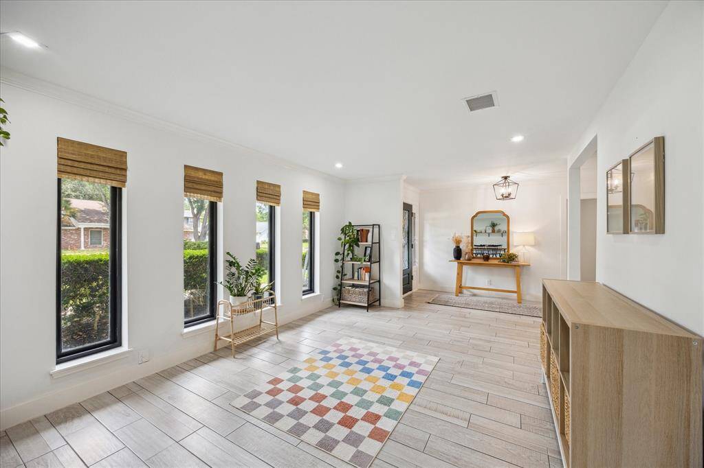 Alternate view of the living room shown open to the entry.