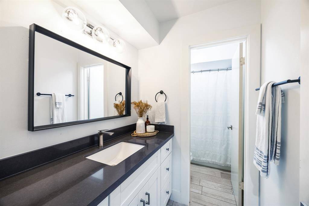 Secondary bathroom features shower with tub.