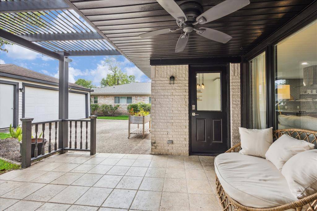Relax & entertain - charming covered patio overlooks the backyard.