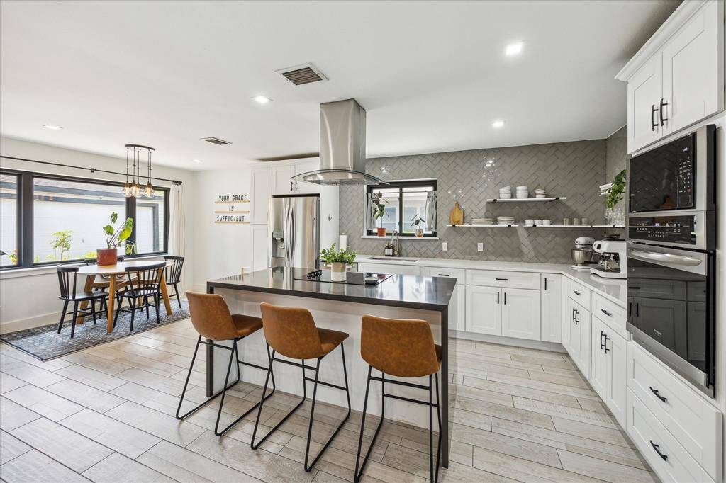 Gourmet kitchen open to the breakfast room.