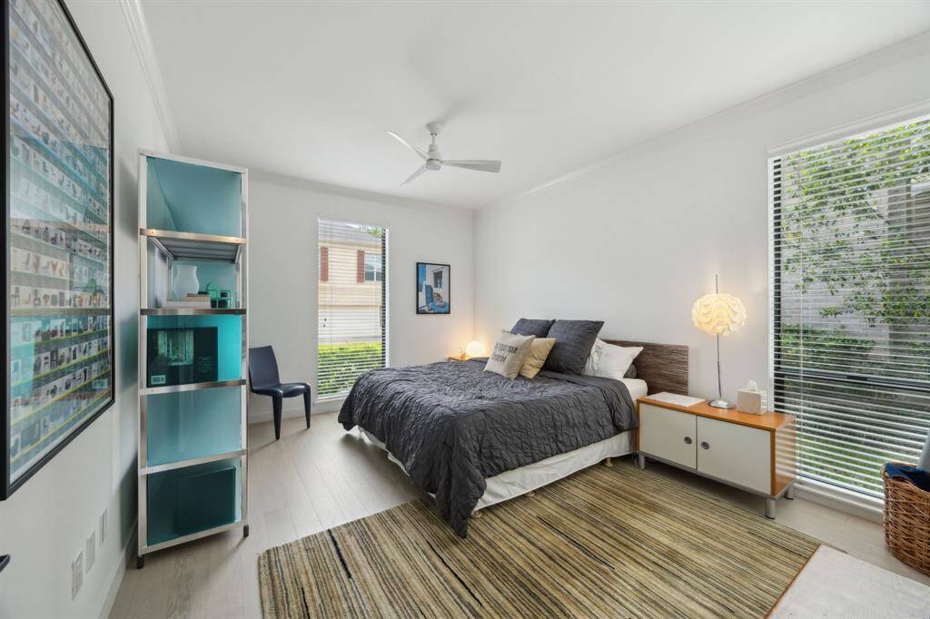 Secondary bedroom is filled with natural light. Note the gorgeous hardwoods which continue throughout the main living areas and bedrooms.