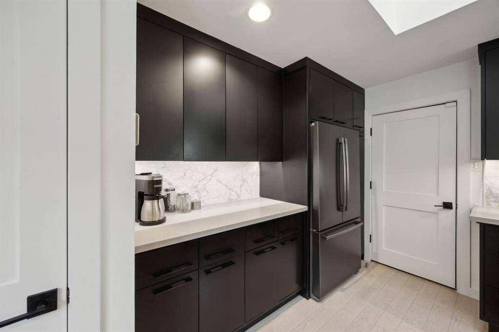 Note the endless storage and prep space in the beautifully upgraded kitchen.