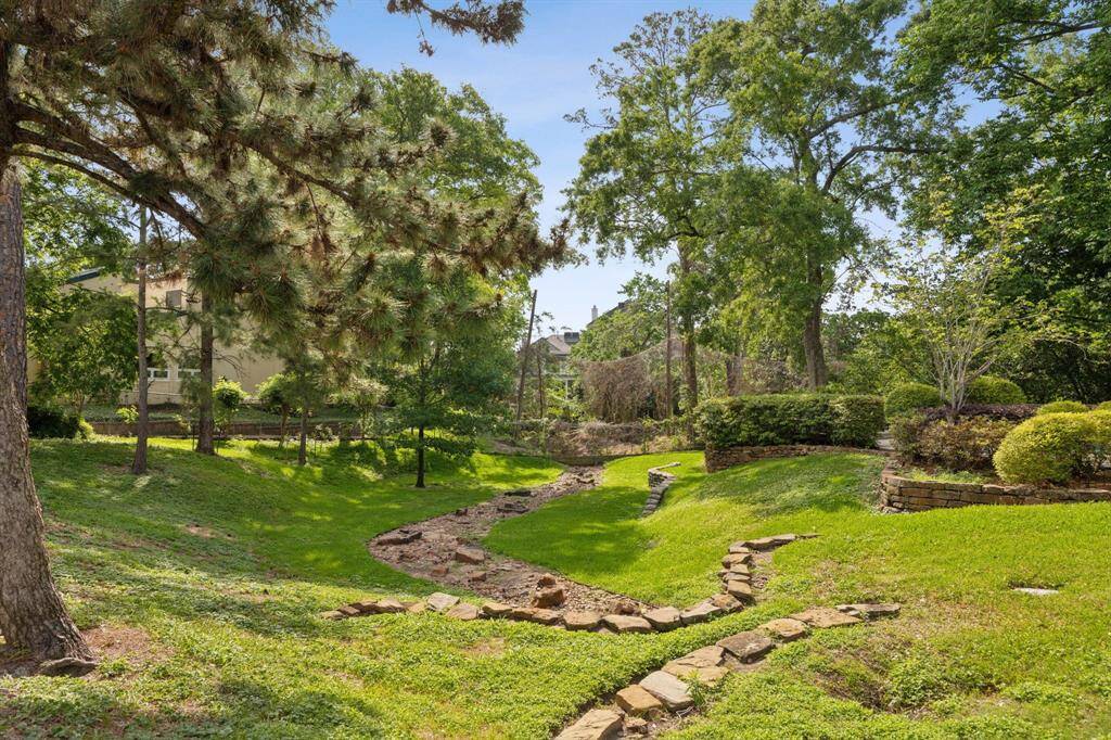 Green space near the community pool. This quiet subdivision is surrounded by lush landscaping.