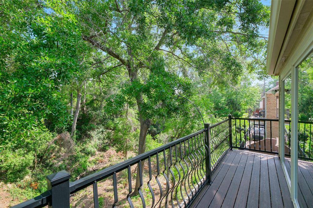 The upstairs balcony offers unmatched privacy and connection to nature, ideal for birdwatching or unwinding.